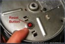 reset button on a garbage disposal